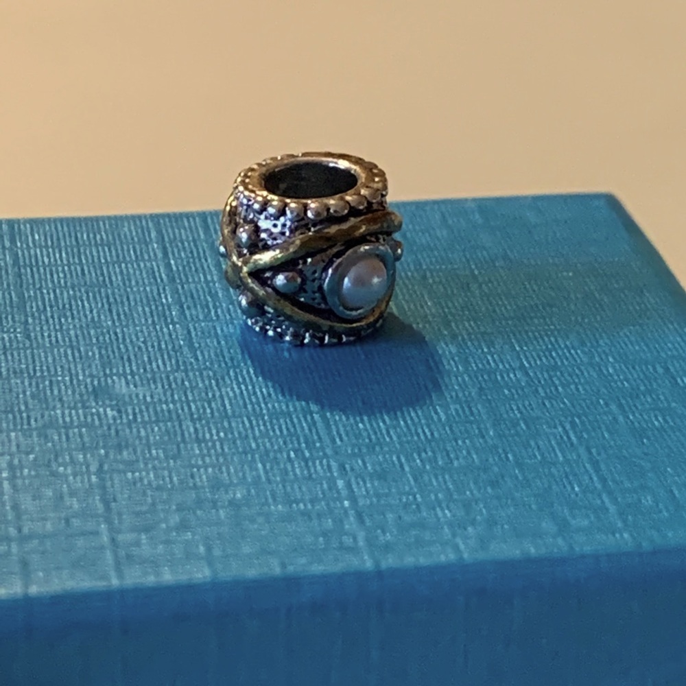 Pugster pearl and two tone bead. Box not included.